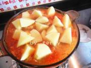 Soup of tomatoes, potatoes, corn, pork ribs
